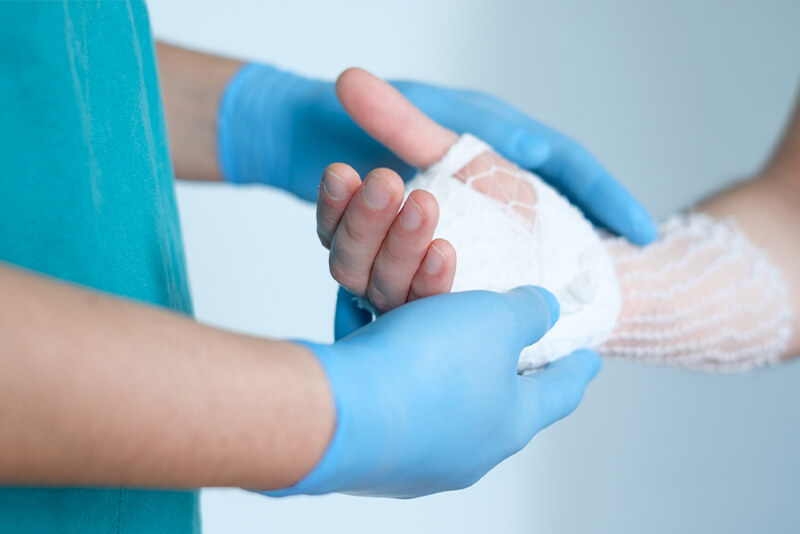 bandaging patient's hand